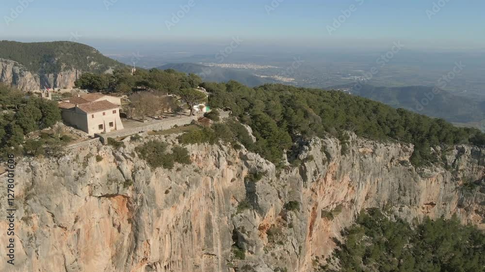 Stunning aerial views showcase the rugged cliffs and lush landscapes of Mallorca, highlighting the beauty of Cap Formentor and the historical Castell de Alaro. Stunning aerial views showcase the rugged cliffs and lush landscapes of Mallorca, highlighting the beauty of Cap Formentor and the historical Castell de Alaro.