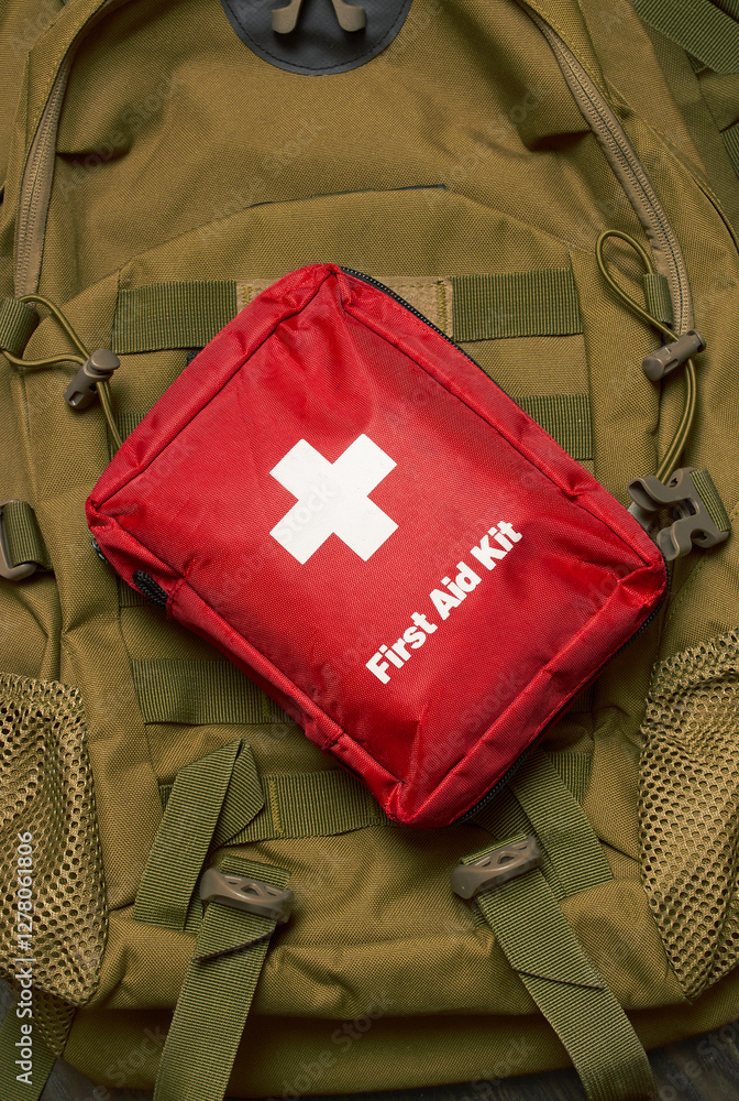 Naklejka premium First Aid Kit on army backpack