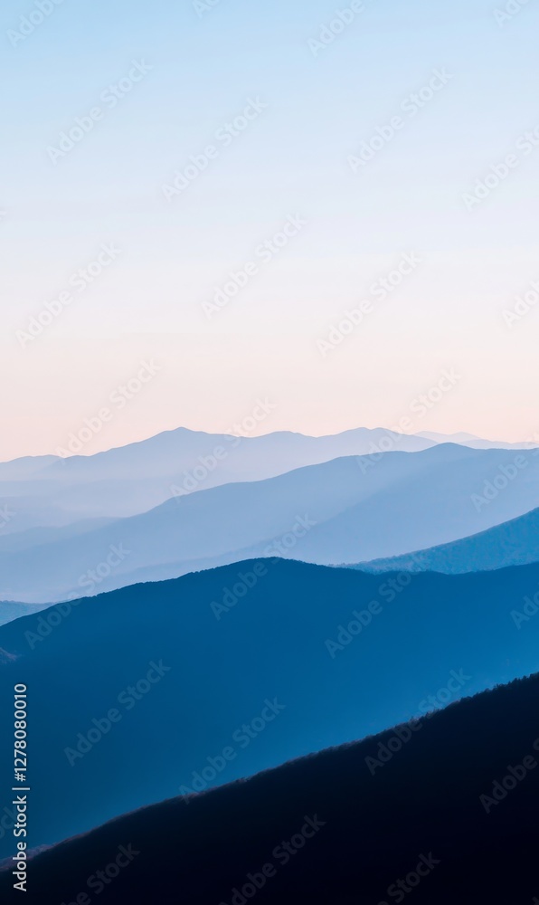 Layers of blue mountains fade into the light sky, minimalist landscape, blue gradient color background Layers of blue mountains fade into the light sky, minimalist landscape, blue gradient color background