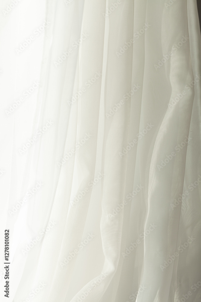 Soft white fabric drapes gracefully, creating a serene and airy ambiance with its gentle folds and light-filtering texture. Simple elegance. Soft white fabric drapes gracefully, creating a serene and airy ambiance with its gentle folds and light-filtering texture. Simple elegance.