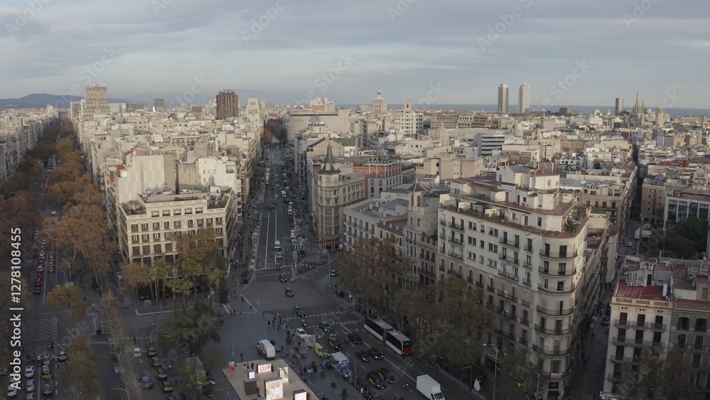 Obraz premium Panoramic bird's-eye view of Barcelona. Drone movement over a busy road junction in the city center