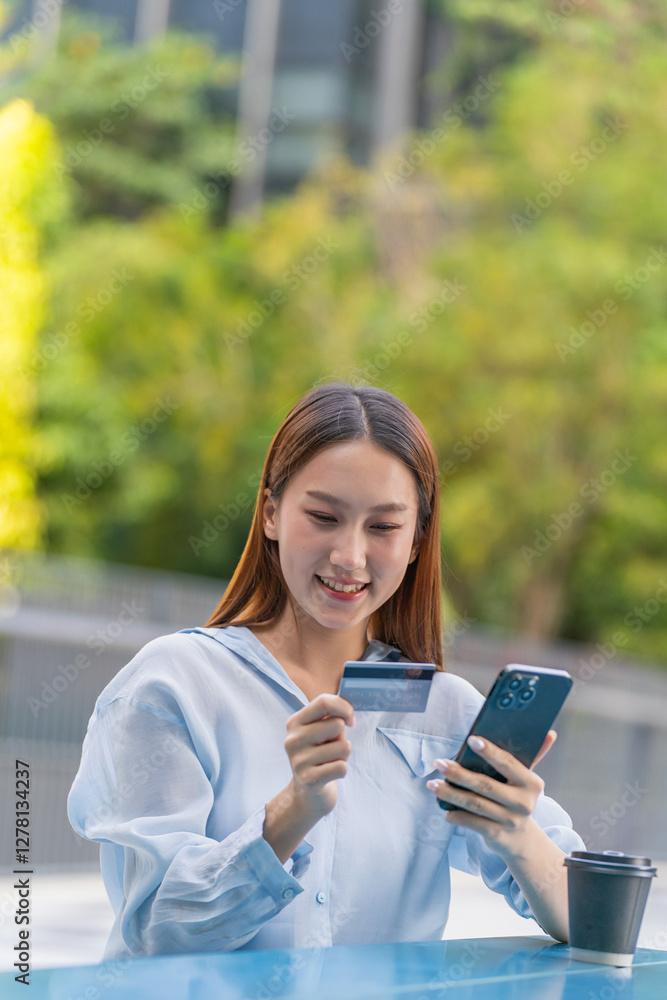 Asian Woman Using Phone and Credit Card Outdoors a Modern Greenery Office Building Asian Woman Using Phone and Credit Card Outdoors a Modern Greenery Office Building