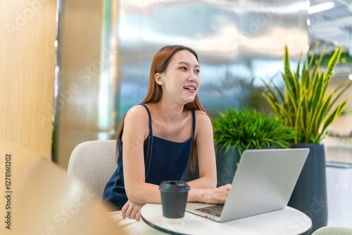 Asian Businesswoman Using Laptop In a Modern Office Free Download Asian Businesswoman Using Laptop In a Modern Office - GFXLoad