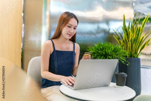 Asian Businesswoman Using Laptop In a Modern Office Free Download Asian Businesswoman Using Laptop In a Modern Office - GFXLoad