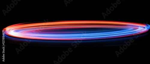 Dynamic Light Painting Capturing Abstract Circular Motion with Vibrant Red and Blue Trails on Black Background