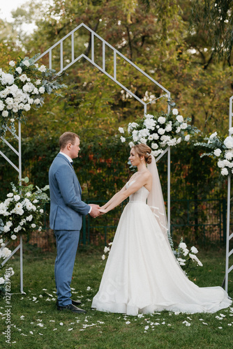 wedding ceremony of the newlyweds on the glade