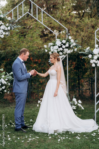 wedding ceremony of the newlyweds on the glade