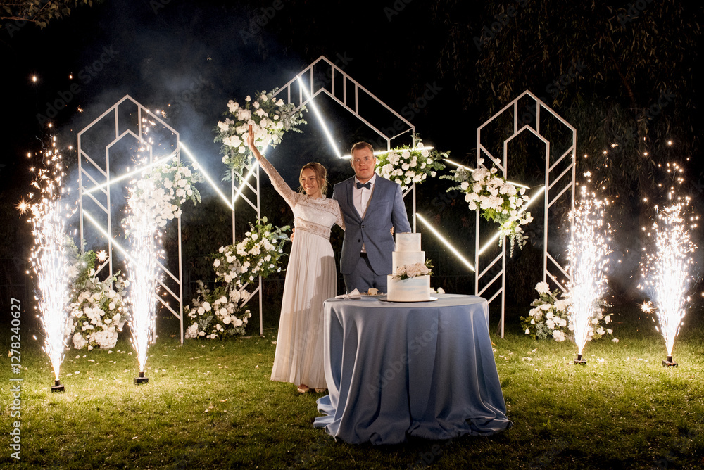newlyweds happily cut and taste the wedding cake