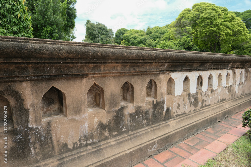 Fototapeta premium Ancient candle holders in the ancient wall, Phra Narai Ratchaniwet, Lopburi, Thailand