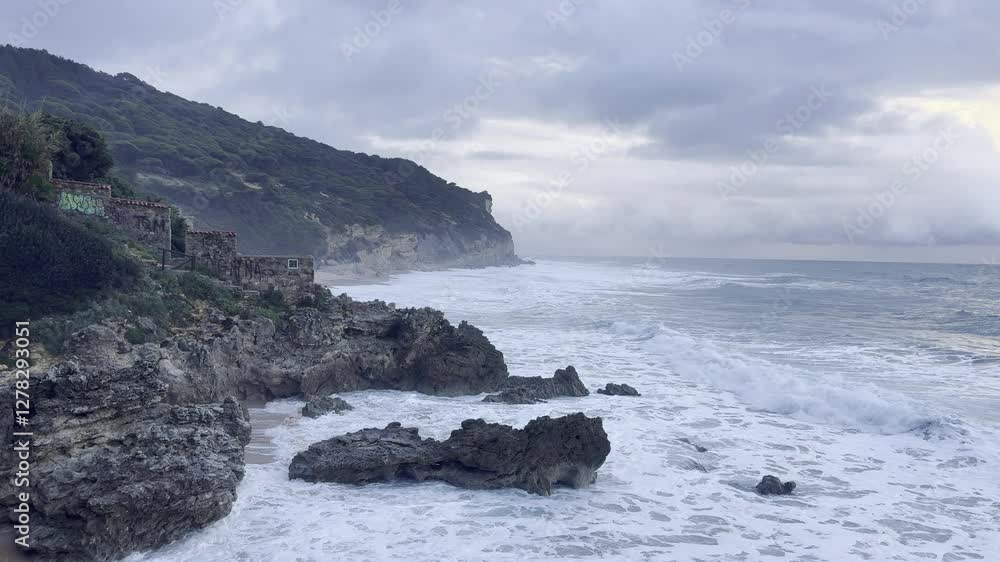 rocky coastline with waves crashing against shore at dusk rocky coastline with waves crashing against shore at dusk