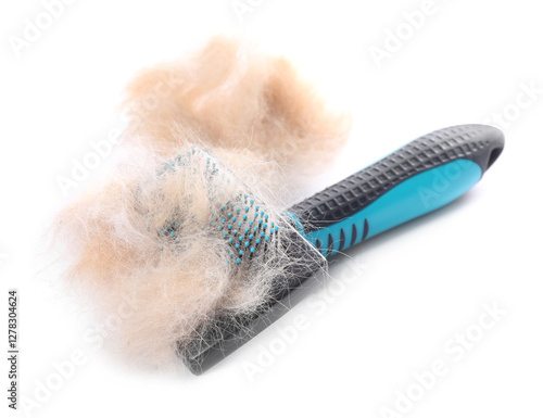 Fotografía Grooming brush and pile of pet's hair isolated on white