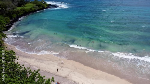 Hamoa Beach Hana Maui Hawaii – A cinematic aerial experience showcasing the crystal-blue ocean, large waves, and lush Hana greenery at this famous Maui surf destination photo