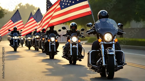 Motorcycle riders parade with American flags along a sunny street in the afternoon