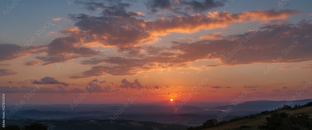 Serene sunset over rolling hills with vibrant clouds casting warm hues across the sky during twilight in a tranquil landscape. Serene sunset over rolling hills with vibrant clouds casting warm hues across the sky during twilight in a tranquil landscape.