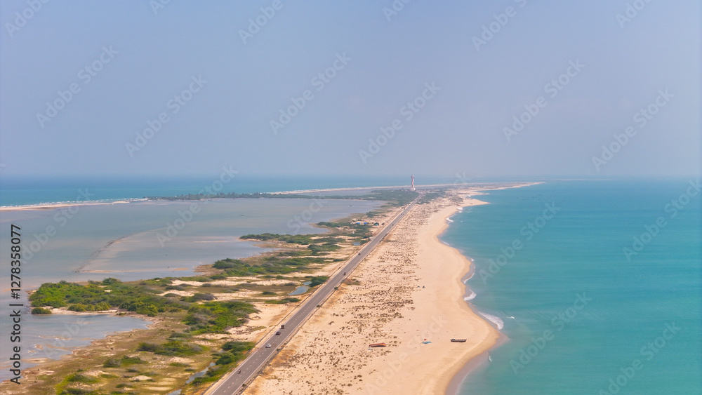 A stunning drone view of Dhanushkodi’s scenic road stretching into the Indian Ocean with light house of Dhanushkodi image view A stunning drone view of Dhanushkodi’s scenic road stretching into the Indian Ocean with light house of Dhanushkodi image view