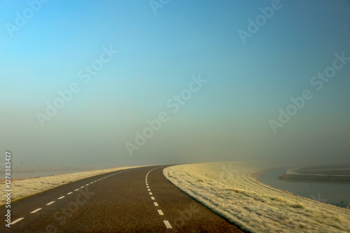 Fields in the Eendragtspolder full of frost in the fog on a cold February morning in Zevenhuizen near the Willem-Alexanderbaan rowing course photo