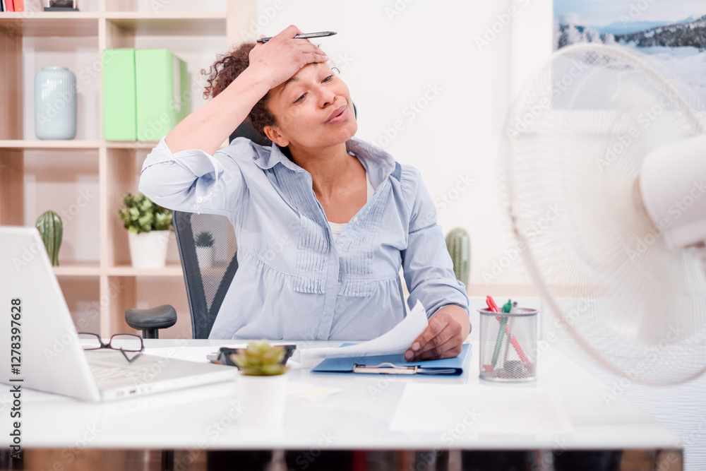Woman working and suffering for summer hot weather Woman working and suffering for summer hot weather