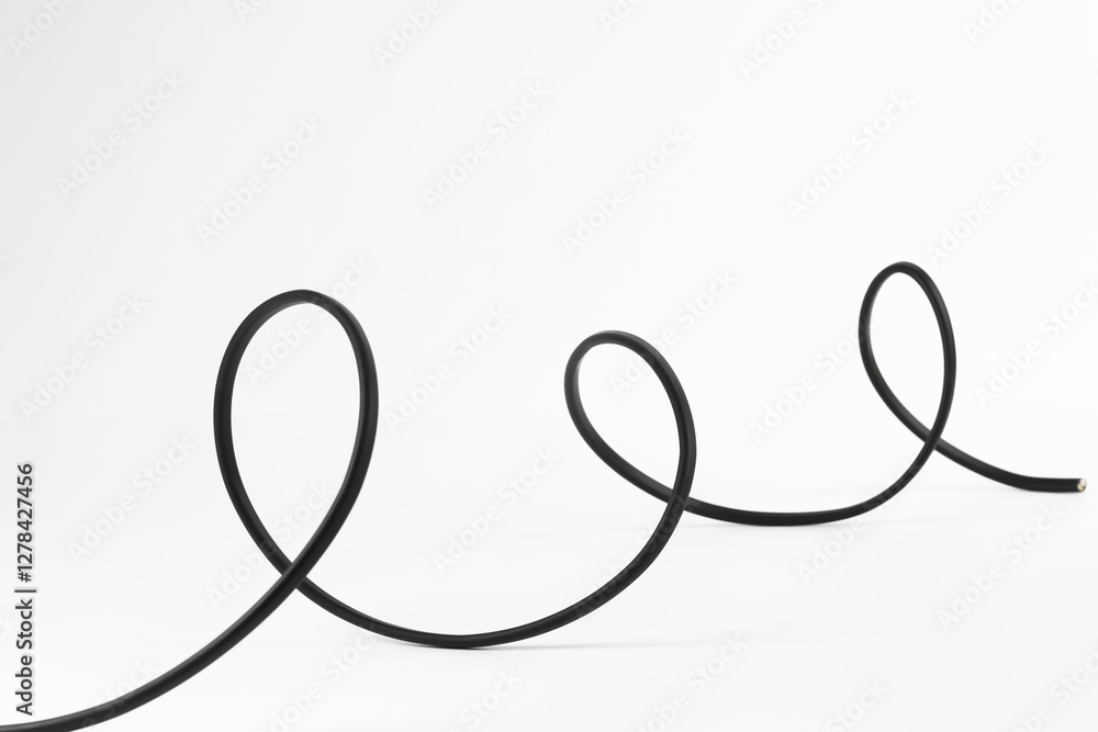 Naklejka premium One black electrical wire isolated on white