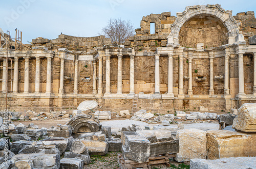 The scenic views of Nymphaeum, or the monumental fountain of Side, is decorated with frescoes, beautiful statues, Corinthian columns and marble niches, Antalya, Turkey photo