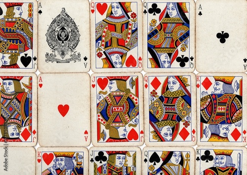 Photography A montage of vintage playing cards in different suits.