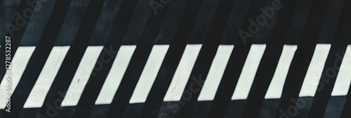 Modern abstract design featuring vertical uneven stripes with dark shadows