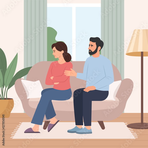 Family conflict. A young couple sits on opposite sides of the couch and don't want to talk to each other.