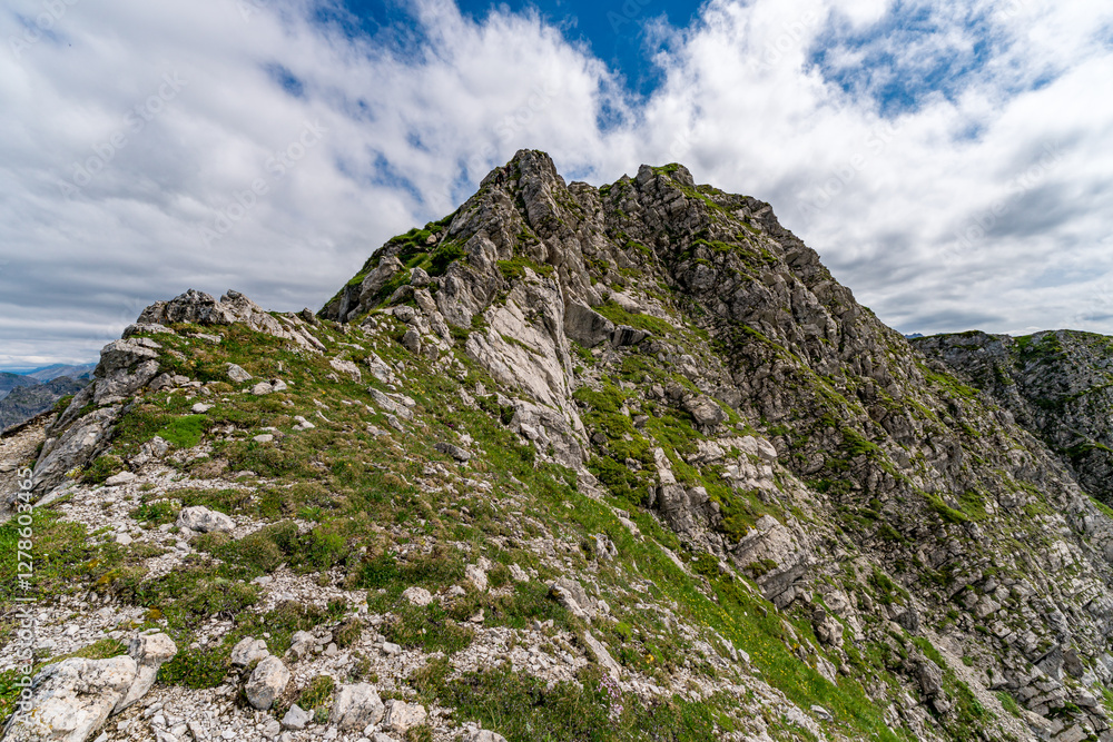 Mountain summit with rocky terrain and cloudy sky in Allgäu region of Bavaria near Bad Hindelang Mountain summit with rocky terrain and cloudy sky in Allgäu region of Bavaria near Bad Hindelang