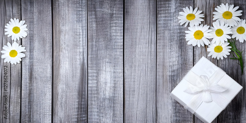Daisies and Gift on Rustic ...
