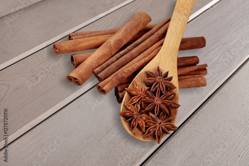 Dry aroma Cinnamon sticks on wooden desk photo