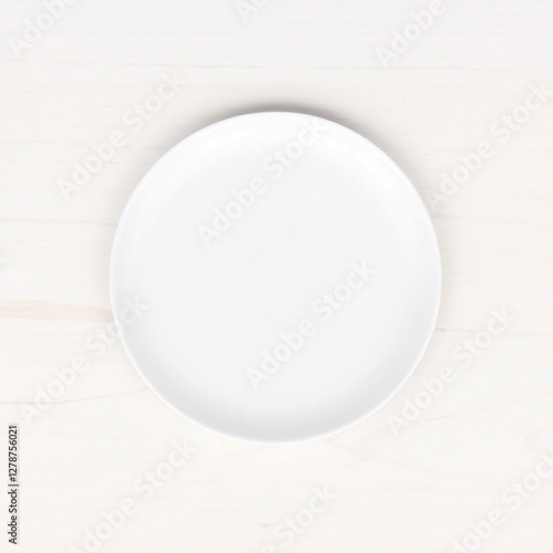 Minimalist White Plate on Light Wooden Table Surface for Design Use