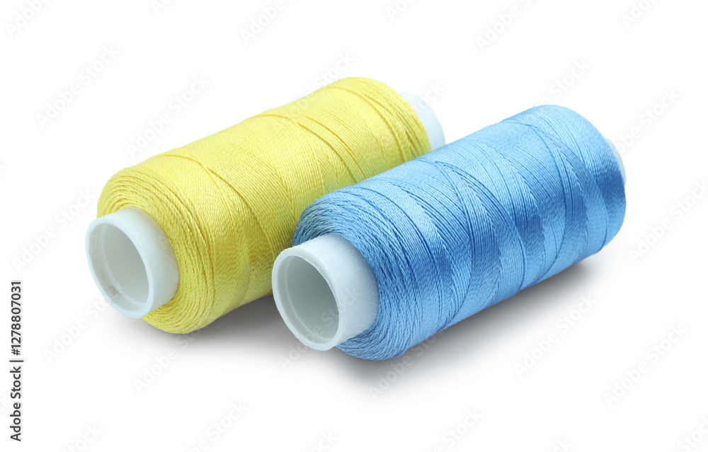 Spools of bright sewing threads isolated on white Spools of bright sewing threads isolated on white