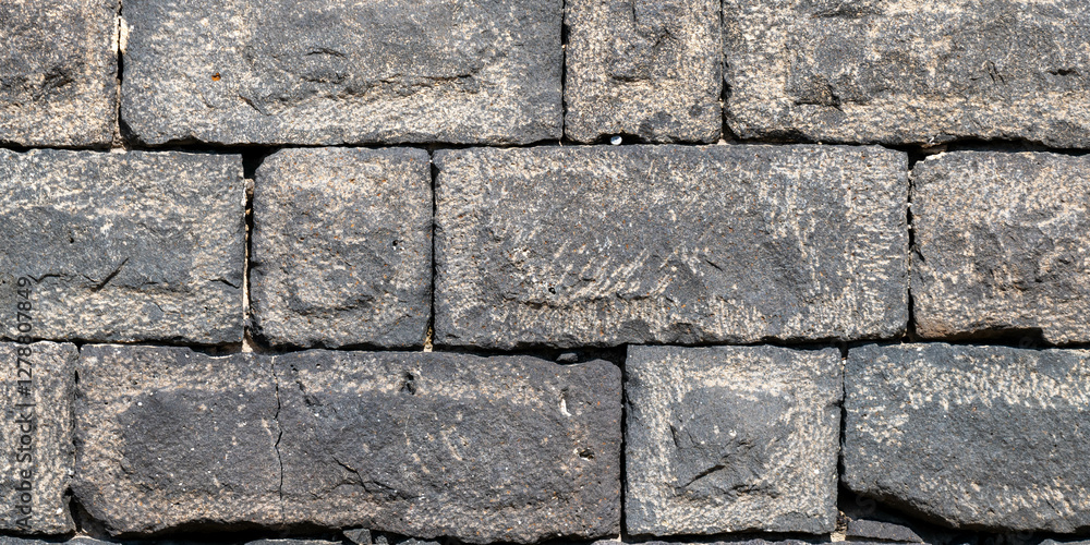 Close up of basalt stone wall at Sussita (Hippos) National Park in the Golan Heights in Israel.
Close up of basalt stone wall at Sussita (Hippos) National Park in the Golan Heights in Israel.