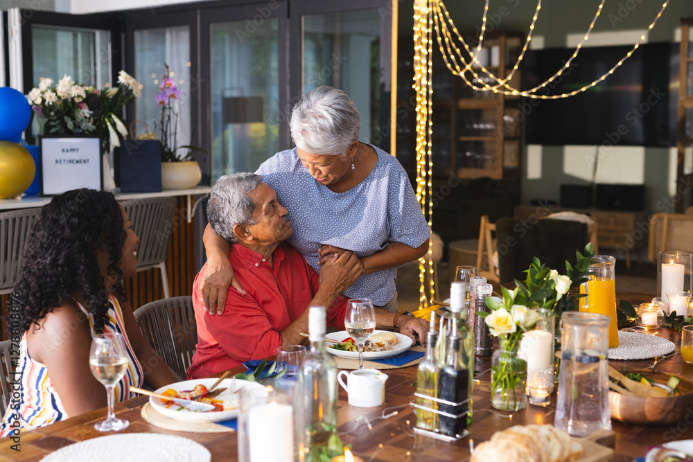 Obraz premium Celebrating retirement, grandparents with multiracial family sharing joyful moments, in garden