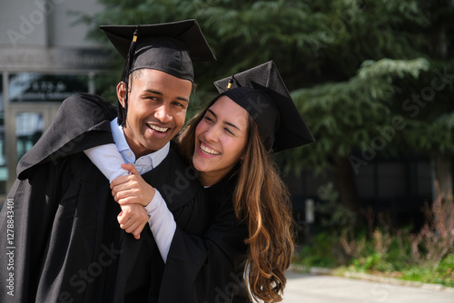 Obraz na płótnie Two graduates celebrating their achievement with big smiles w salonie
