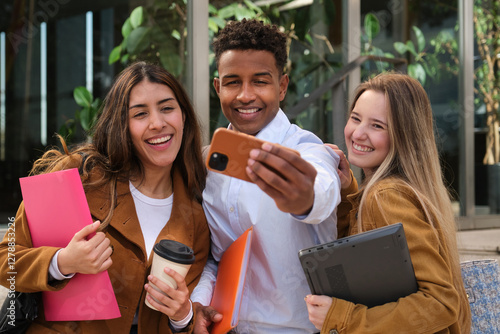 Group of cheerful multi ethnic university students taking selfie outdoors