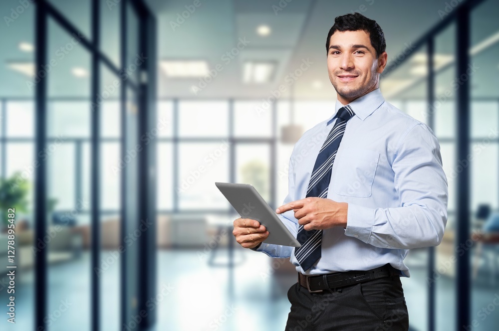 Smiling busy business man manager use tablet computer Smiling busy business man manager use tablet computer