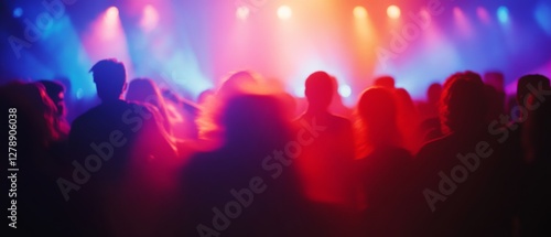 Silhouetted figures dance in a vibrant, colorful club scene, surrounded by multicolored lights and a palpable atmosphere of energy and excitement.