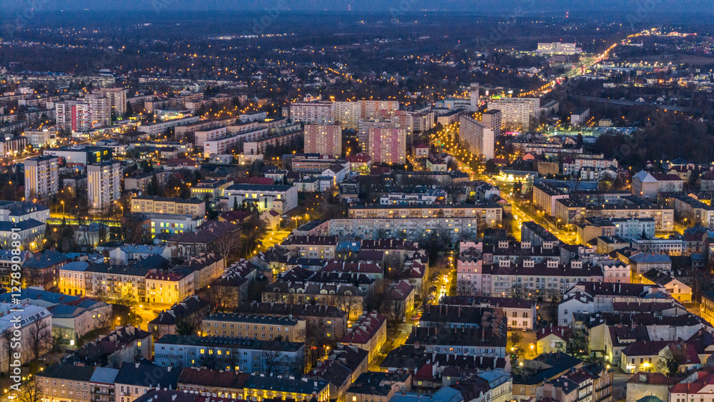 Obraz premium Tarnow illuminated old town townscape, aerial drone view, Poland.