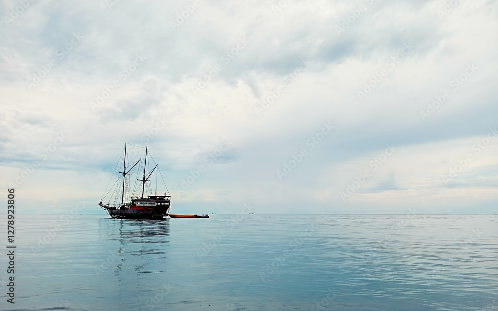 Liveaboard Dive Ship Near a Tropical Island Liveaboard Dive Ship Near a Tropical Island