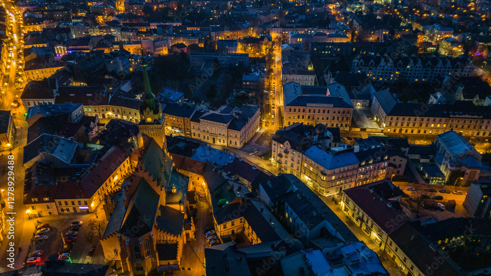 Tarnow illuminated old town townscape, aerial drone view, Poland.
