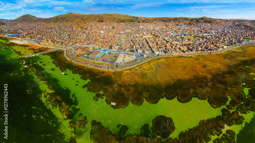 Aerial panorama of Puno with Lake Titicaca in Peru, South America. photo