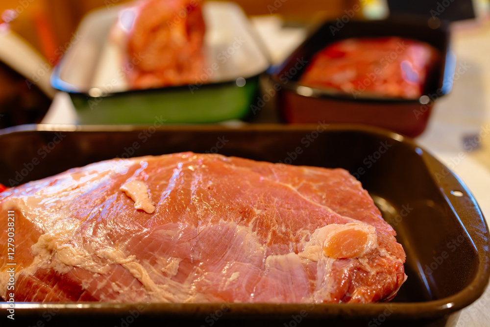 Assorted Raw Meat Cuts in Baking Trays Ready for Cooking Assorted Raw Meat Cuts in Baking Trays Ready for Cooking