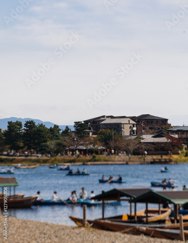 Arashiyama district panorama in western Kyoto, Japan, with boats and mountain Arashi, Togetsukyo bridge, Katsura Hozu River, autumn fall landscape view, travel to Japan, Kansai region, Kyoto photo