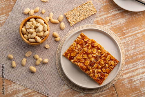 Chinese Peanut and Sesame Bar,Peanut brittle crisp candy in a plate.Thai snack.Top view.