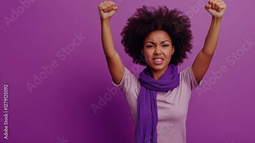 A afro woman actively participating in a protest advocating for women's rights.