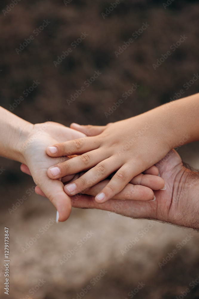 Baby holding mother's finger close-up photo. Parental support Baby holding mother's finger close-up photo. Parental support