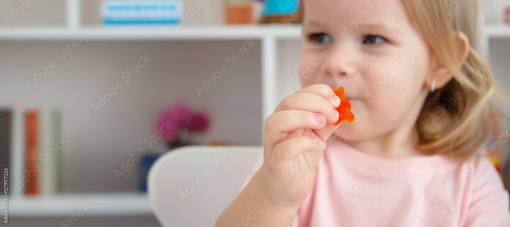 Little girl eating jelly candies or vitamins. Kid. Little girl eating jelly candies or vitamins. Kid.
