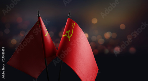 Fotografi Small flags of the USSR on an abstract blurry background