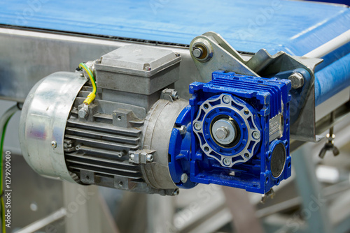 Wallpaper Mural Geared motor on a blue belt conveyor.
 Torontodigital.ca