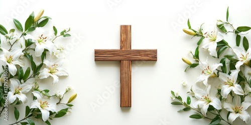 Wooden cross surrounded by white lilies on a light background for a spiritual or religious theme